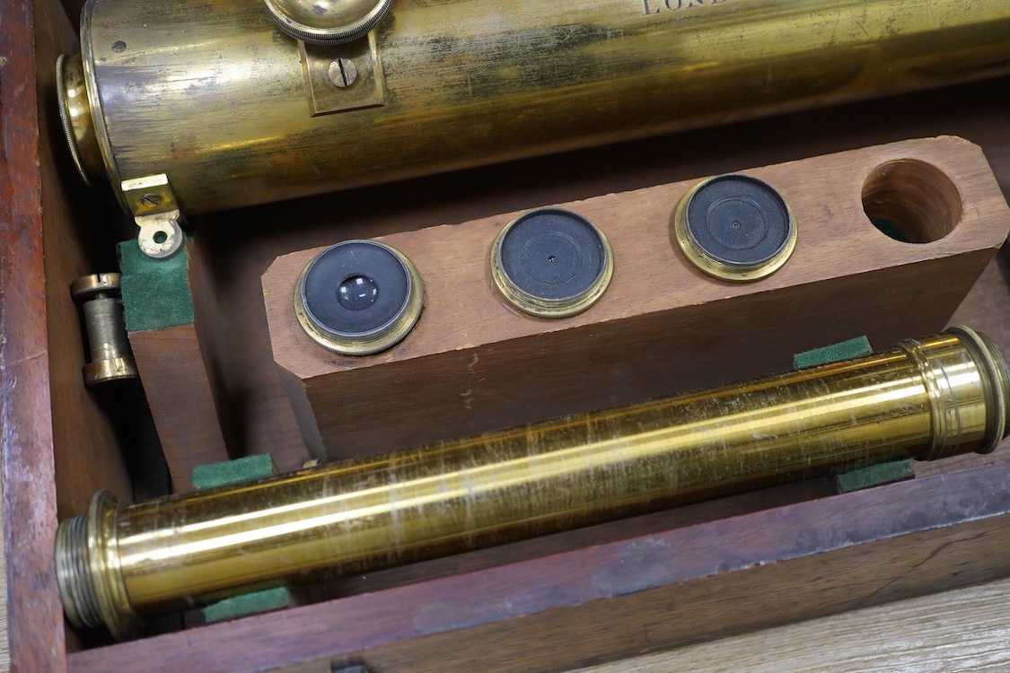 A late 19th century brass single drawer refracting telescope by F.L. West, 39 Southampton Street, Strand, London, in a fitted mahogany case, with folding brass tabletop tripod stand, and a number of alternative lenses, t